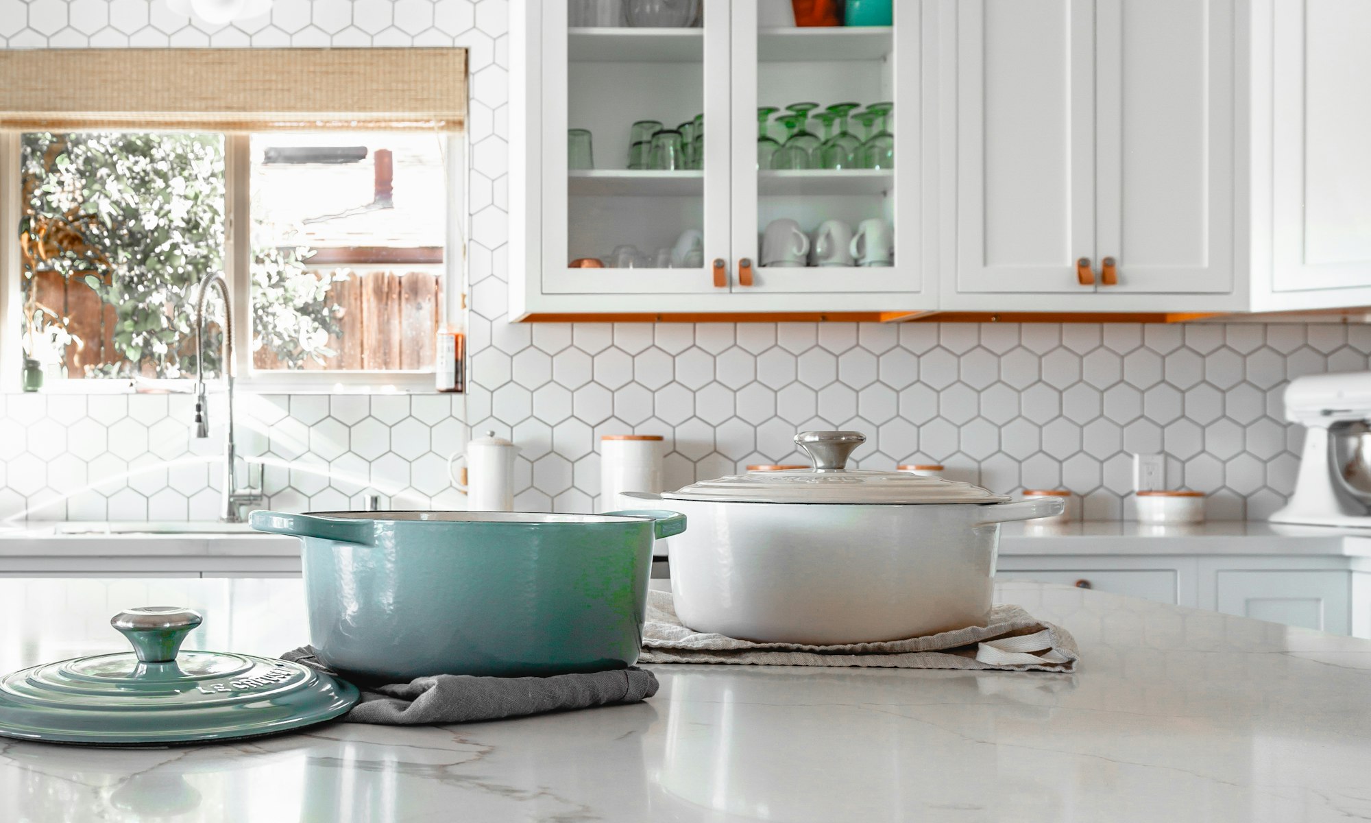 Bright modern kitchen with cookware on the island