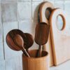 Wooden cooking utensil set in holder